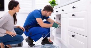 plumber working at a home with a permit